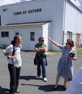 The town manager of Oxford, Maryland, points to flooding zones in the distance.